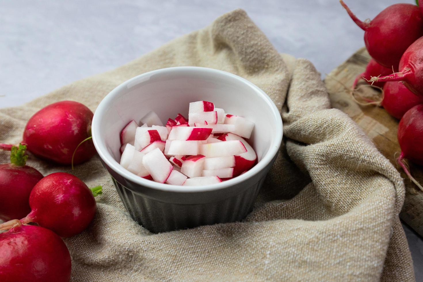 Chopped radish in a bowl. Preparation of ingredients for food. photo