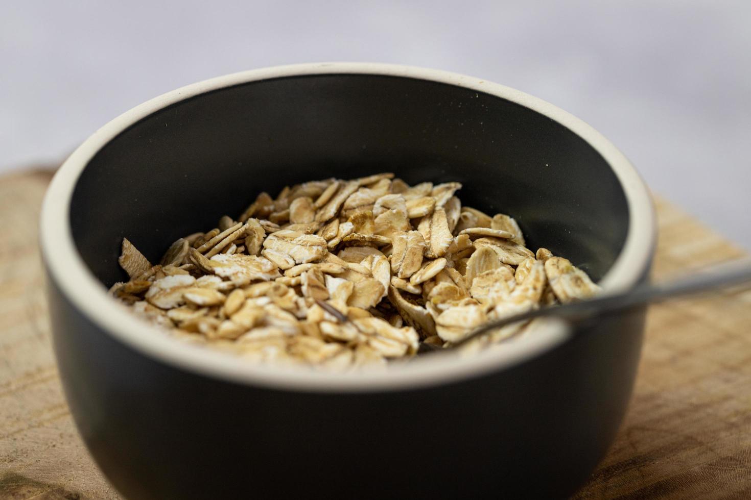 Oatmeal in a bowl. Breakfast ingredient. photo