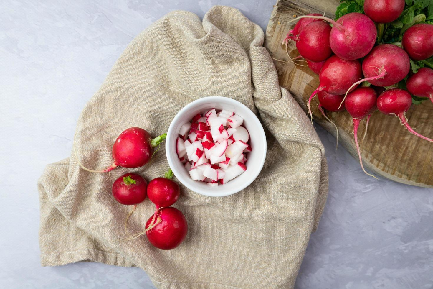 Chopped radish in a bowl. Preparation of ingredients for food. Top view. photo