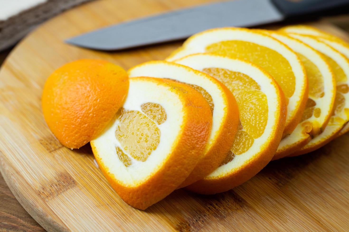 Sliced oranges ready to eat or dry in the oven. photo