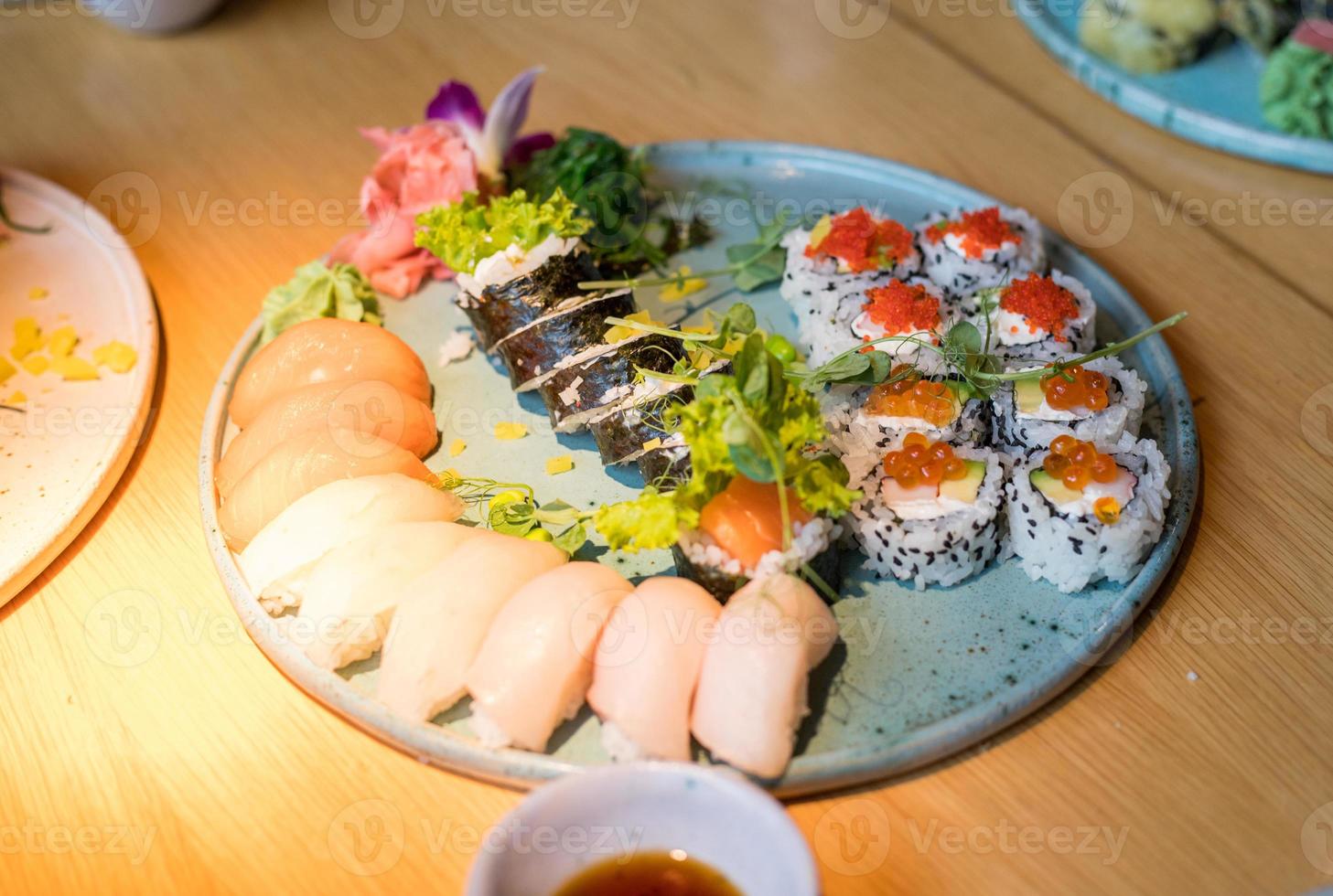 Plates full of sushi. Different types of delicious Japanese food. photo