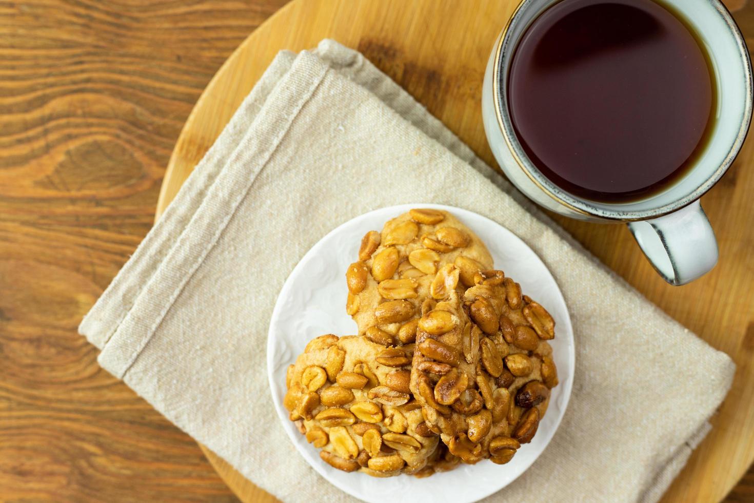 Shortbread cookies with nuts and tea. Delicious dessert. photo