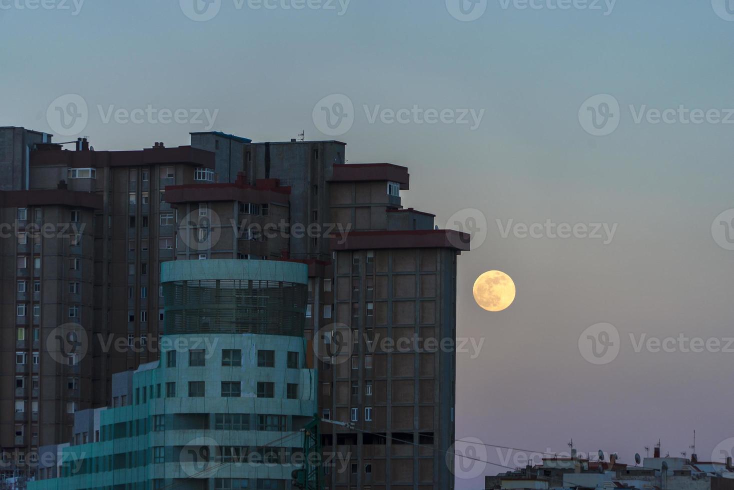 moonrise between buildings in Las palmas of Gran Canaria photo