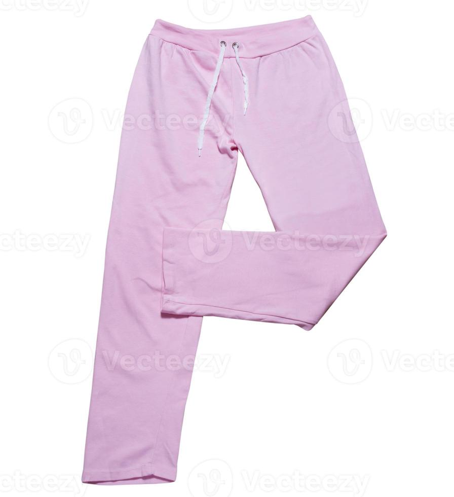 Pantalones deportivos femeninos de color rosa para niños aislado sobre un fondo blanco. foto