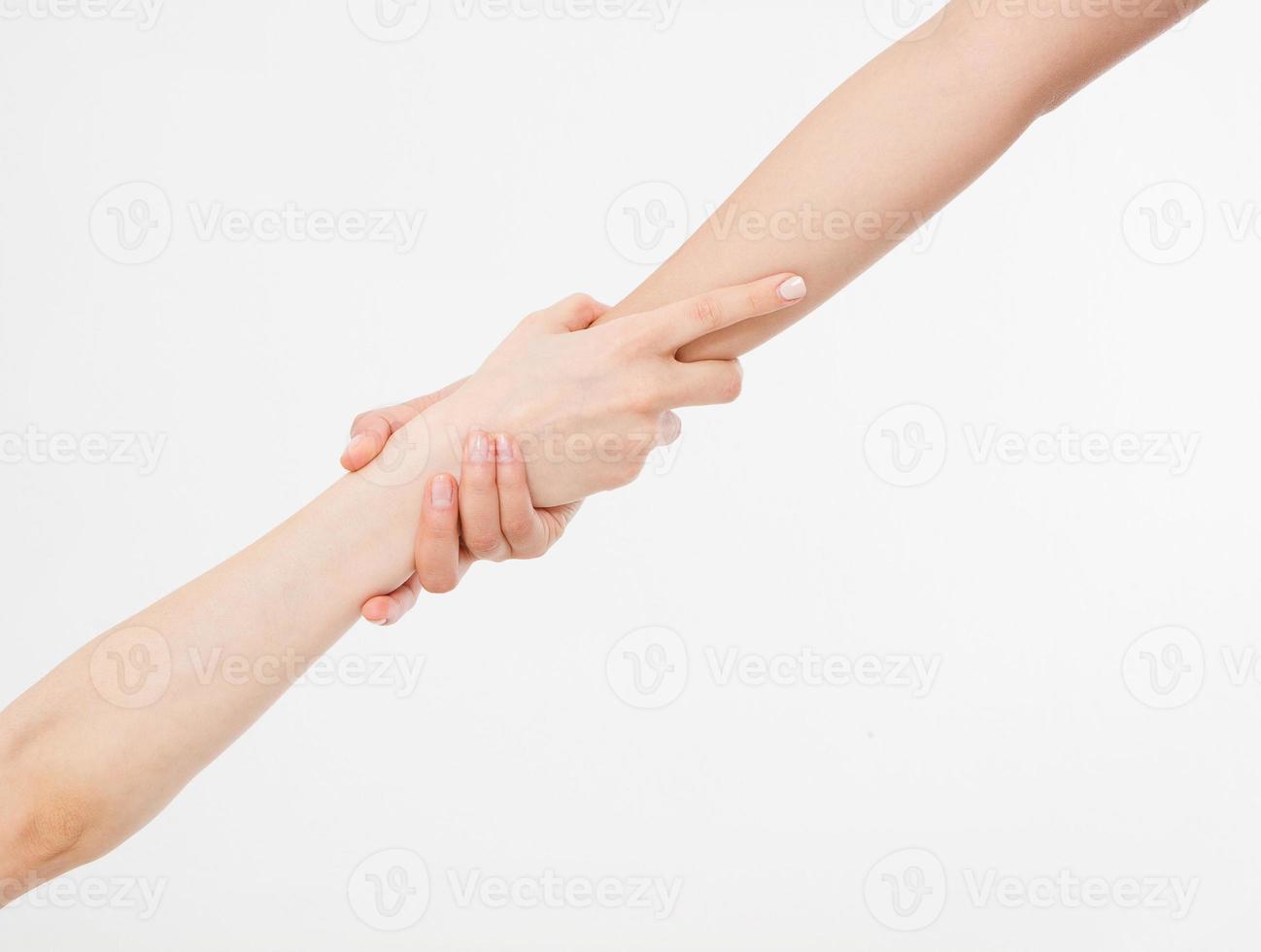 Two hands isolated. Helping hand to a friend. Copy space. Rescue or helping gesture of arms. photo