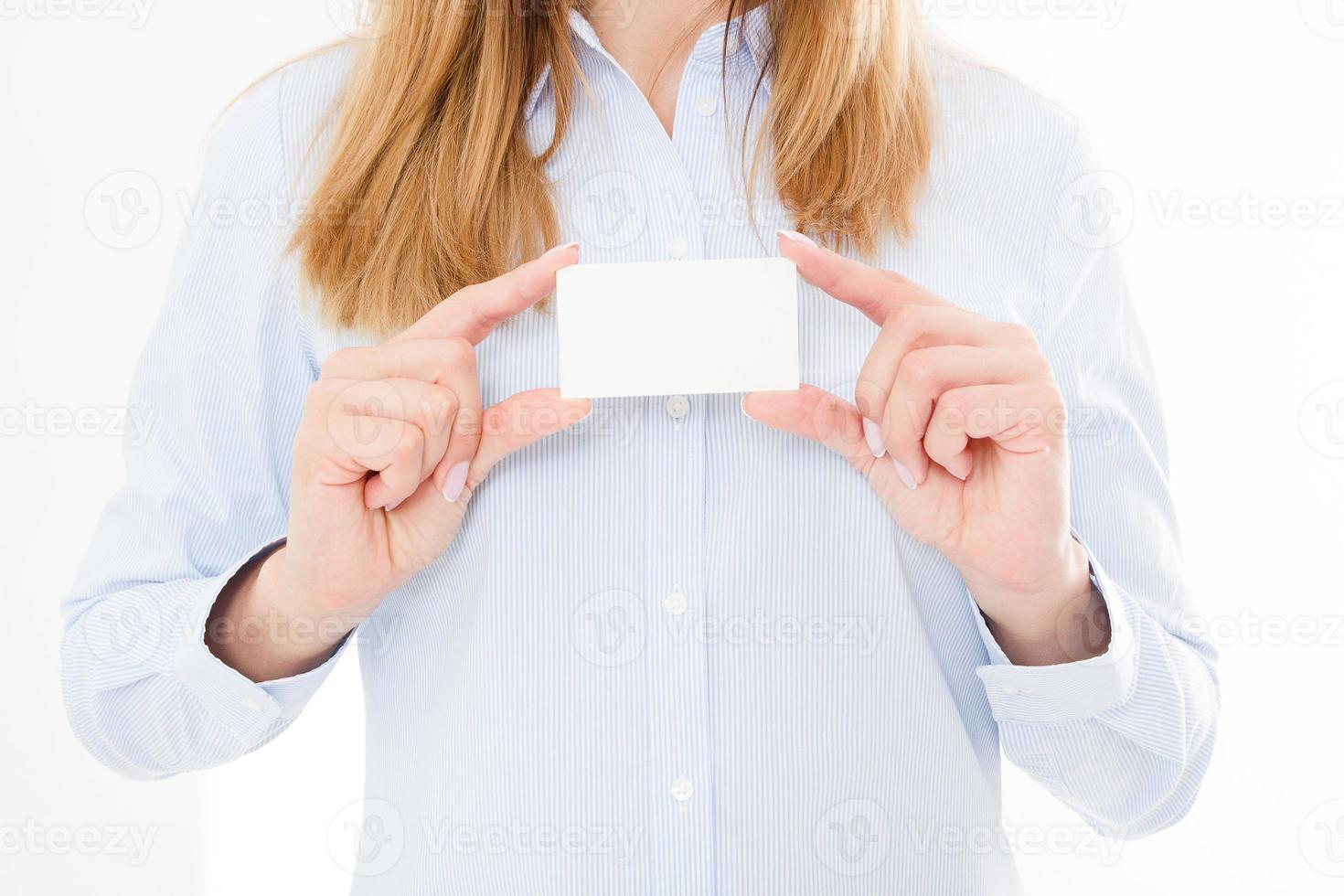 woman holding a blank business card isolated on white background. Copy space photo