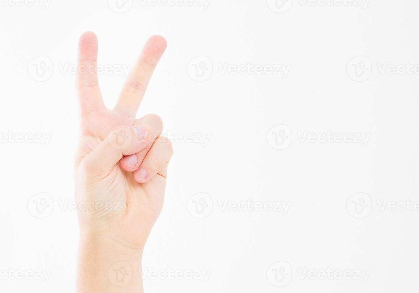 hand showing the sign of victory or peace closeup isolated on white background.Front view. Mock up. Copy space. Template. Blank. photo