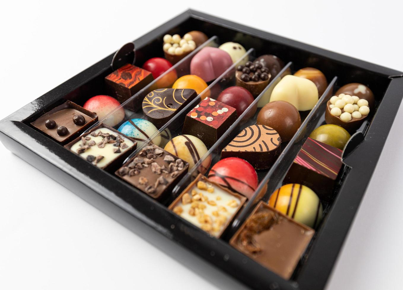 Various types of pralines. Delicious looking chocolates. photo