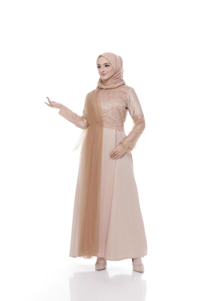 Full body portrait of lady use a wedding dress, wedding makeup on hijab. Malay or indonesia wedding dress, beauty or eidul fitri concept. Beautiful southeast asian muslim woman posing in islam dress photo