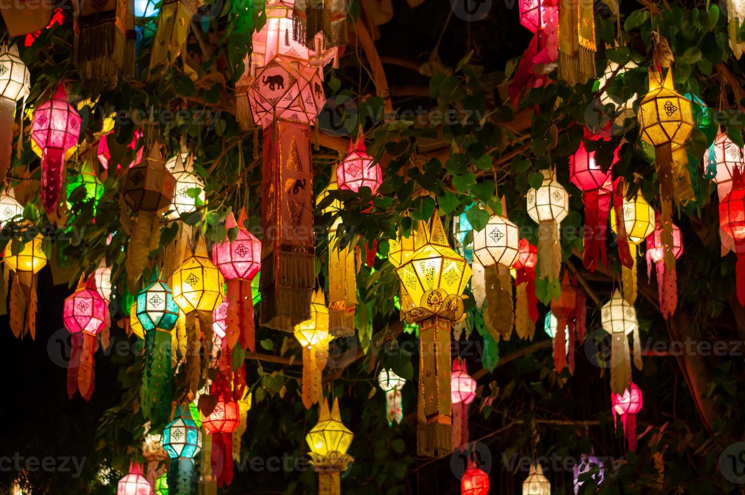 Antique decorative lantern hanging at night with bright and colorful colors. photo