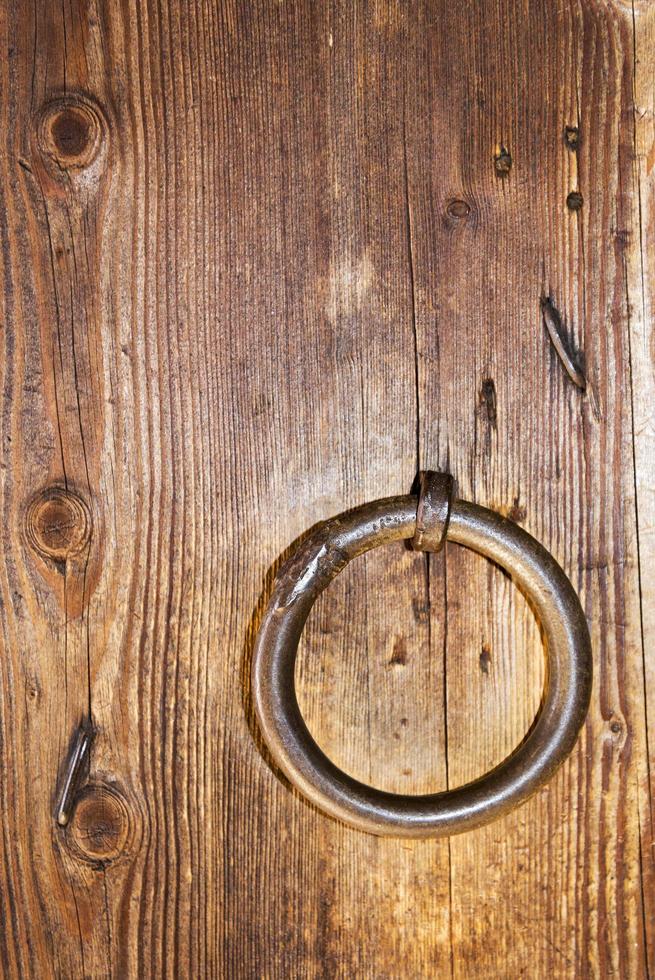 A wooden door with a ring. photo