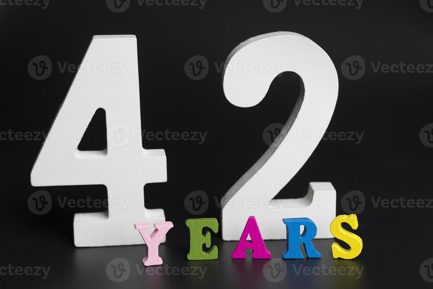 Letters and numbers forty-two on a black background. photo
