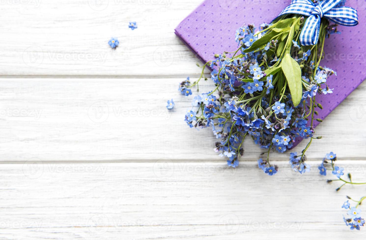 Forget-me-not flowers and notebook photo