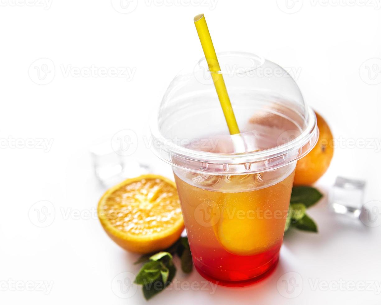 Fresh cocktail with orange and ice photo