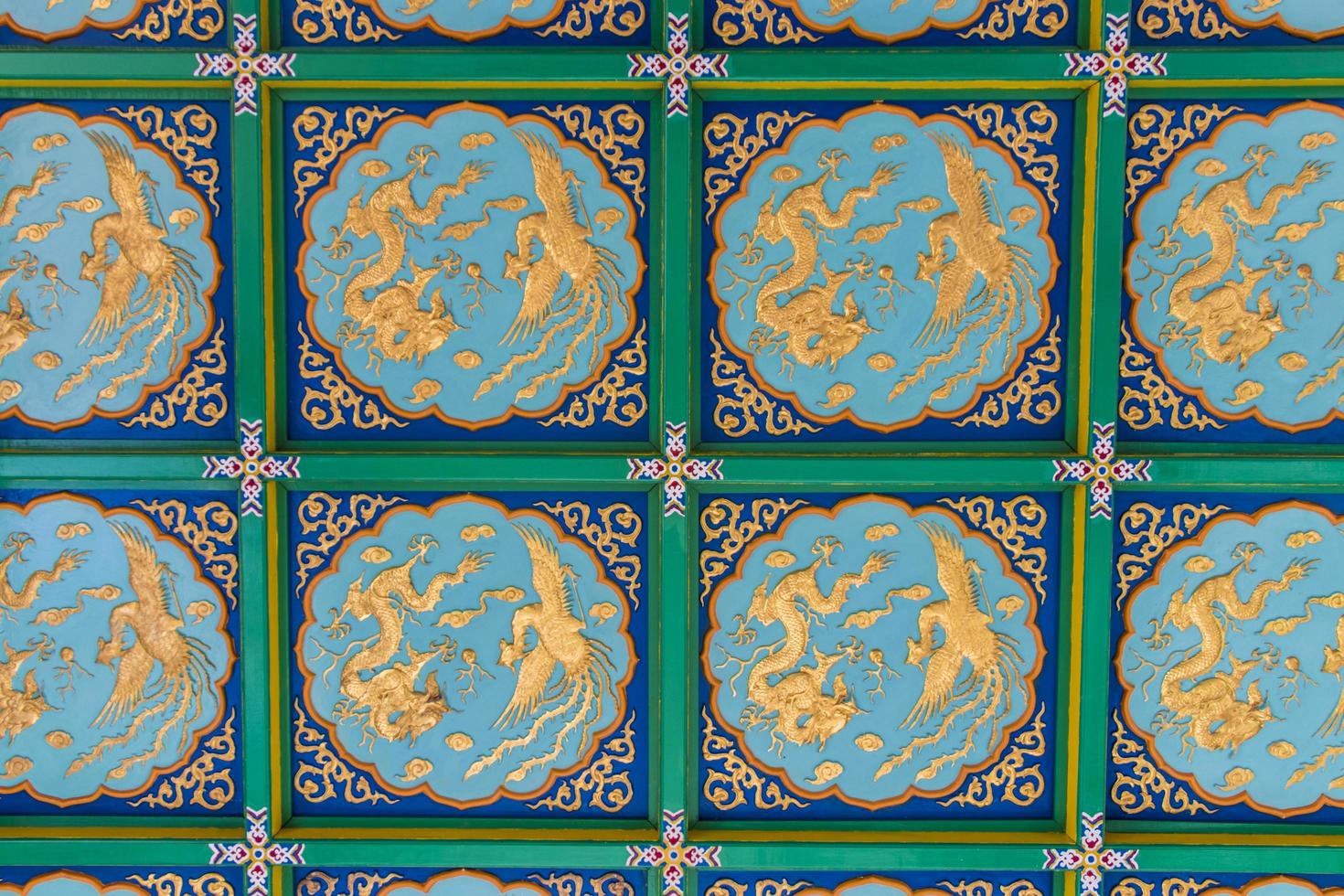 Wall texture golden dragons blue turquoise background, Thean Hou temple. photo