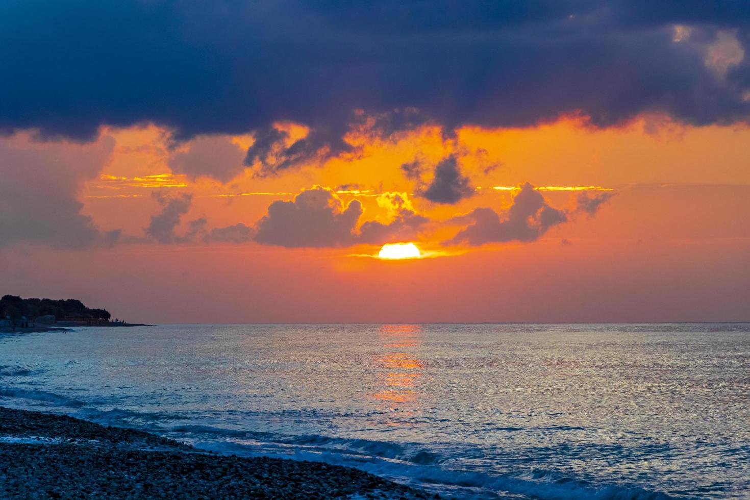 The most beautiful colorful golden sunset Ialysos Beach Rhodes Greece. photo