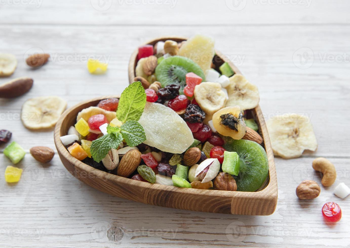 Bowls with various dried fruits and nuts photo