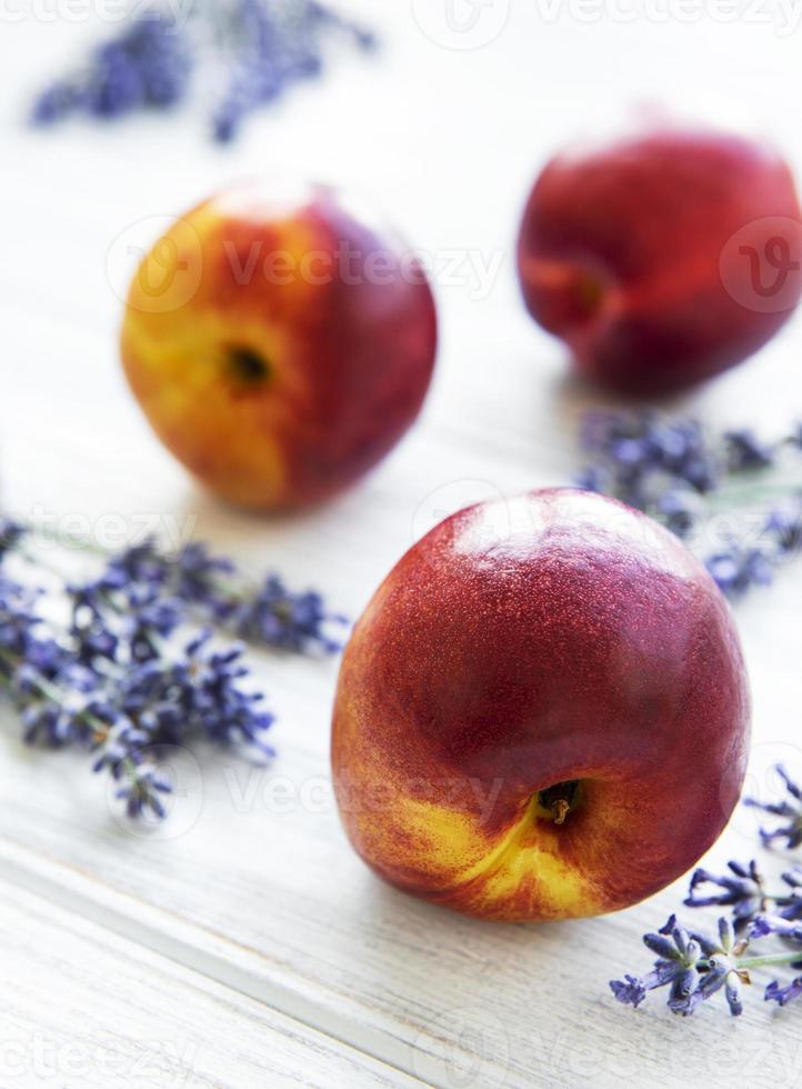 Nectarines and flowers of lavender photo