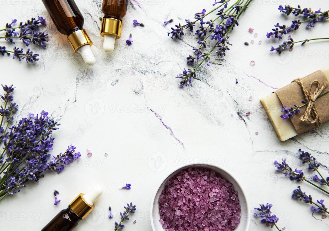 Natural herb cosmetic with lavender,  flatlay on white marble background,  top view photo
