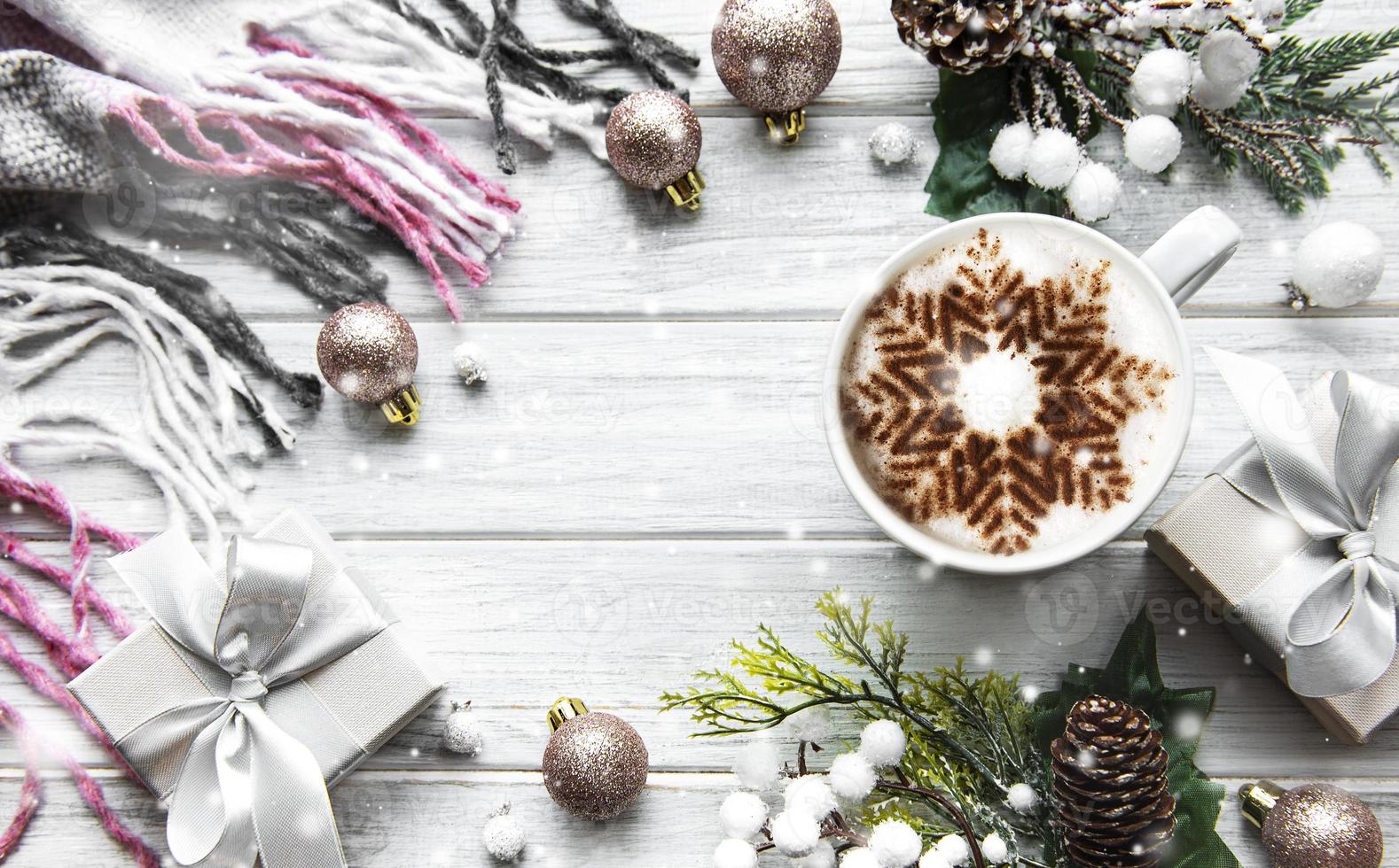 Christmas or winter composition. Frame made of  decorations on white wooden background. photo