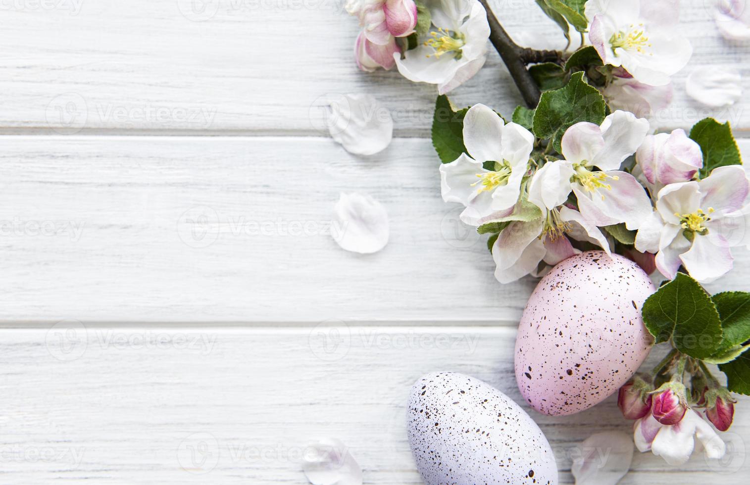 Colorful Easter eggs with spring blossom flowers photo