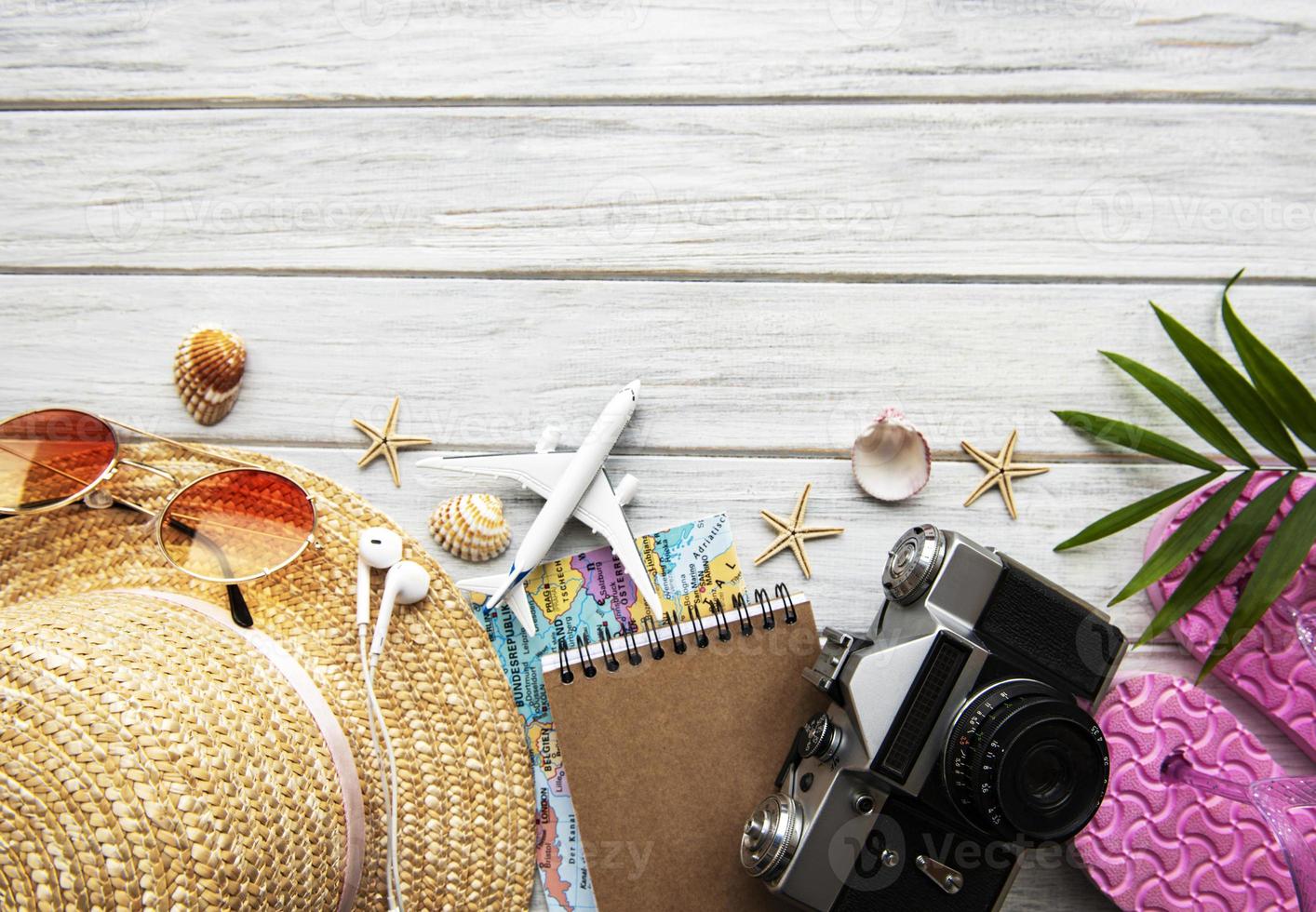 Traveler accessories on wooden  background photo