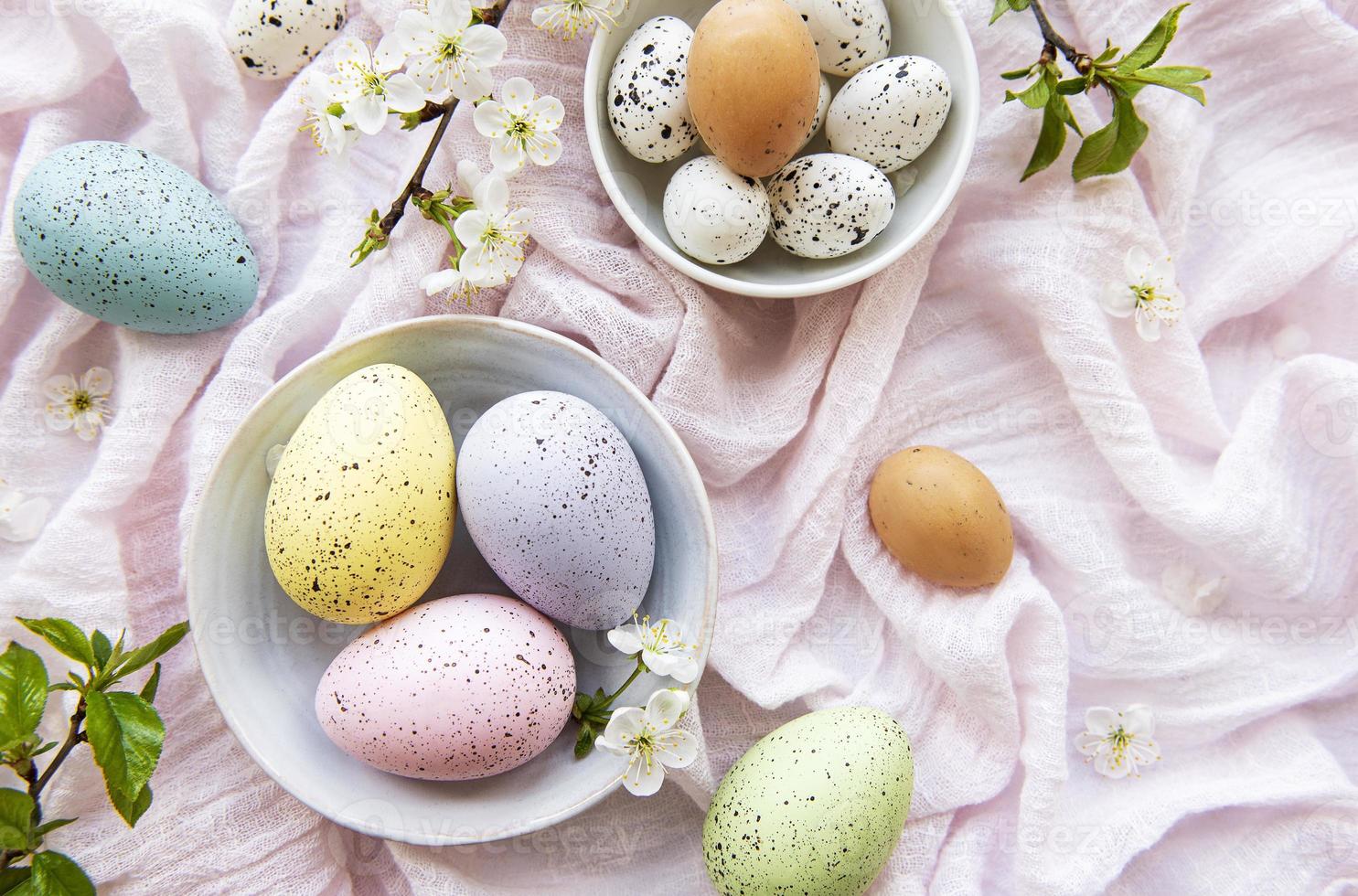 Colorful Easter eggs with spring blossom flowers photo