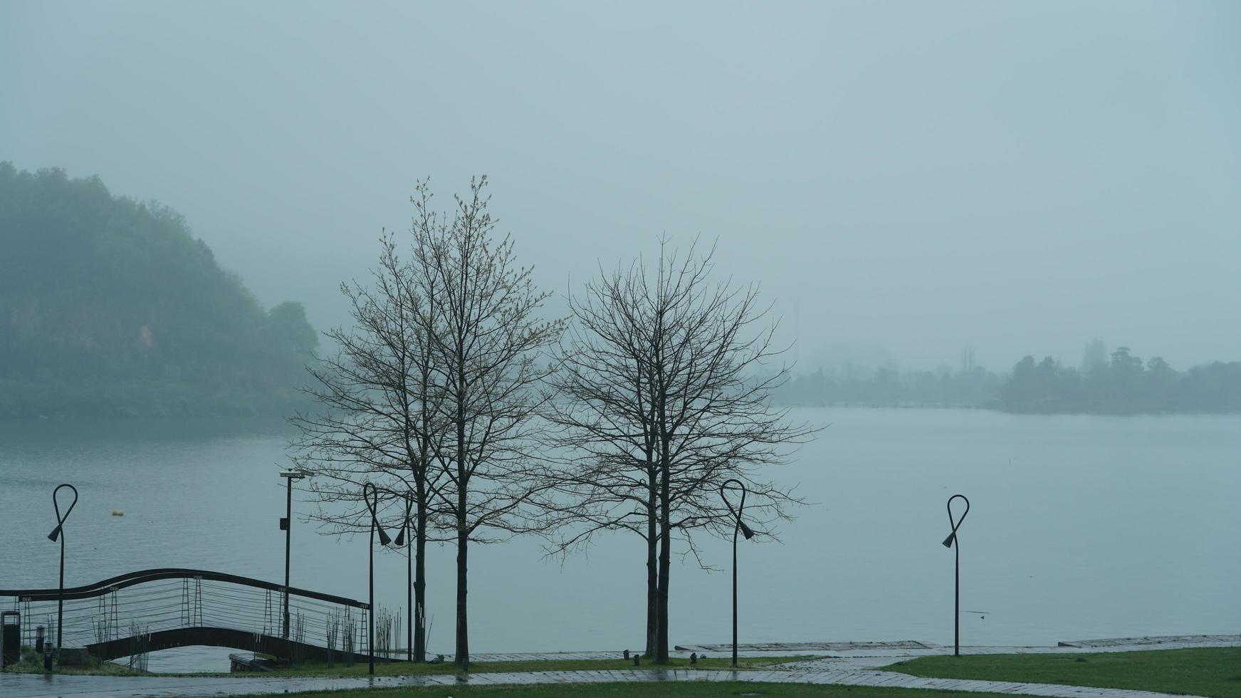 The beautiful lake landscapes in the Hangzhou city of the China in spring with the peaceful lake and fresh green mountains photo