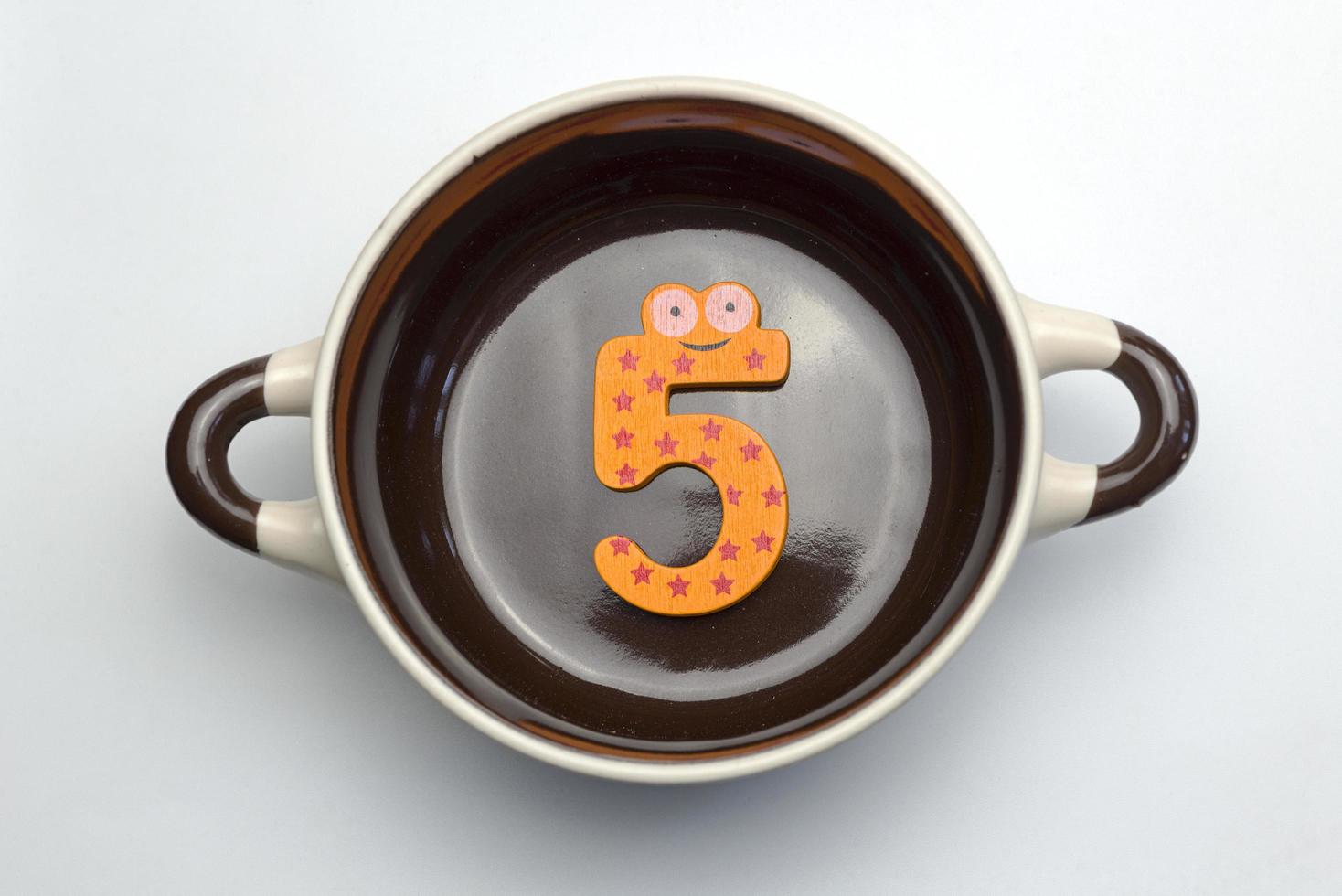 Figure five on the bottom of the tureen. photo