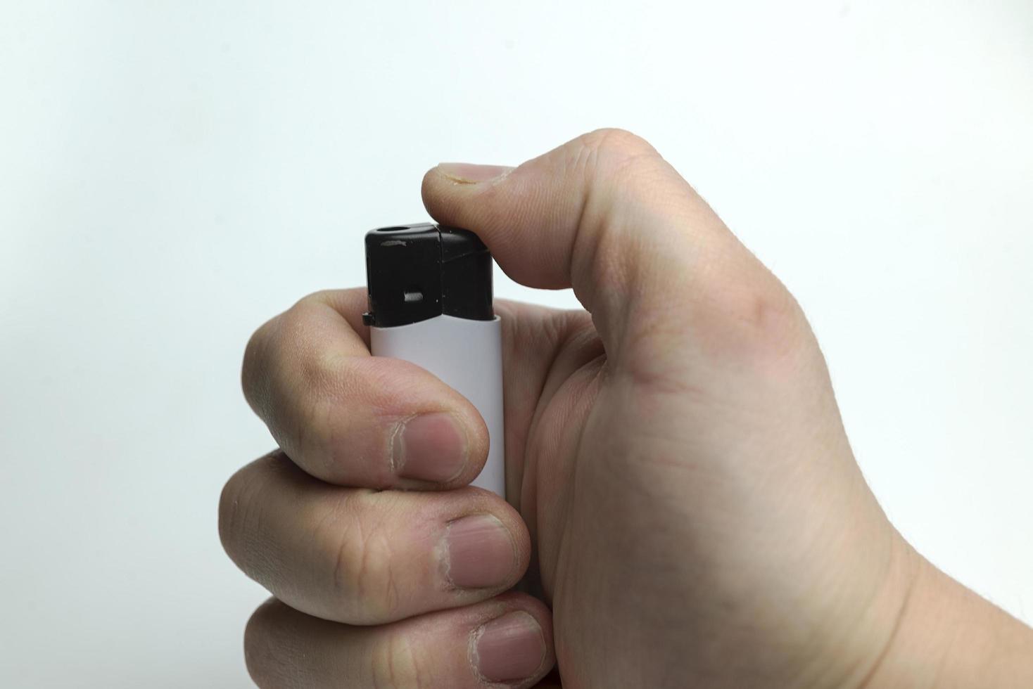 Hand holding a lighter. photo