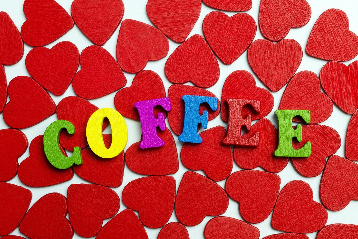 The word coffee is laid out on the hearts. photo