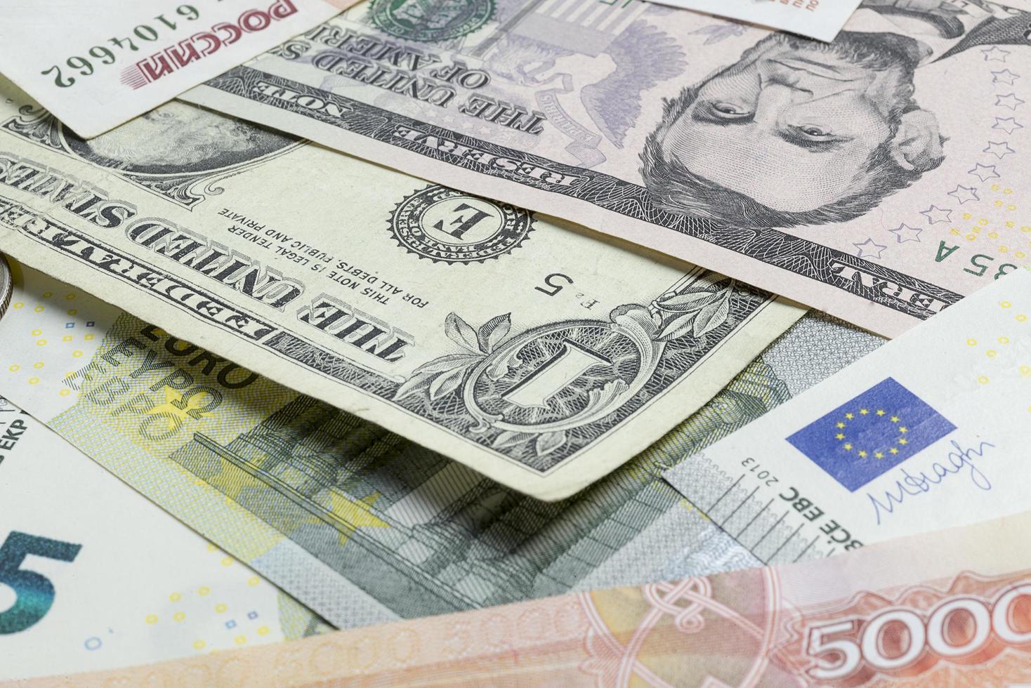 Many banknotes are on the table. photo