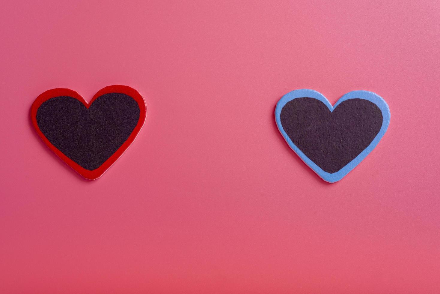 Valentine's Day, Mother's Day, Birthday. Two decorative hearts in the middle on a pink background photo