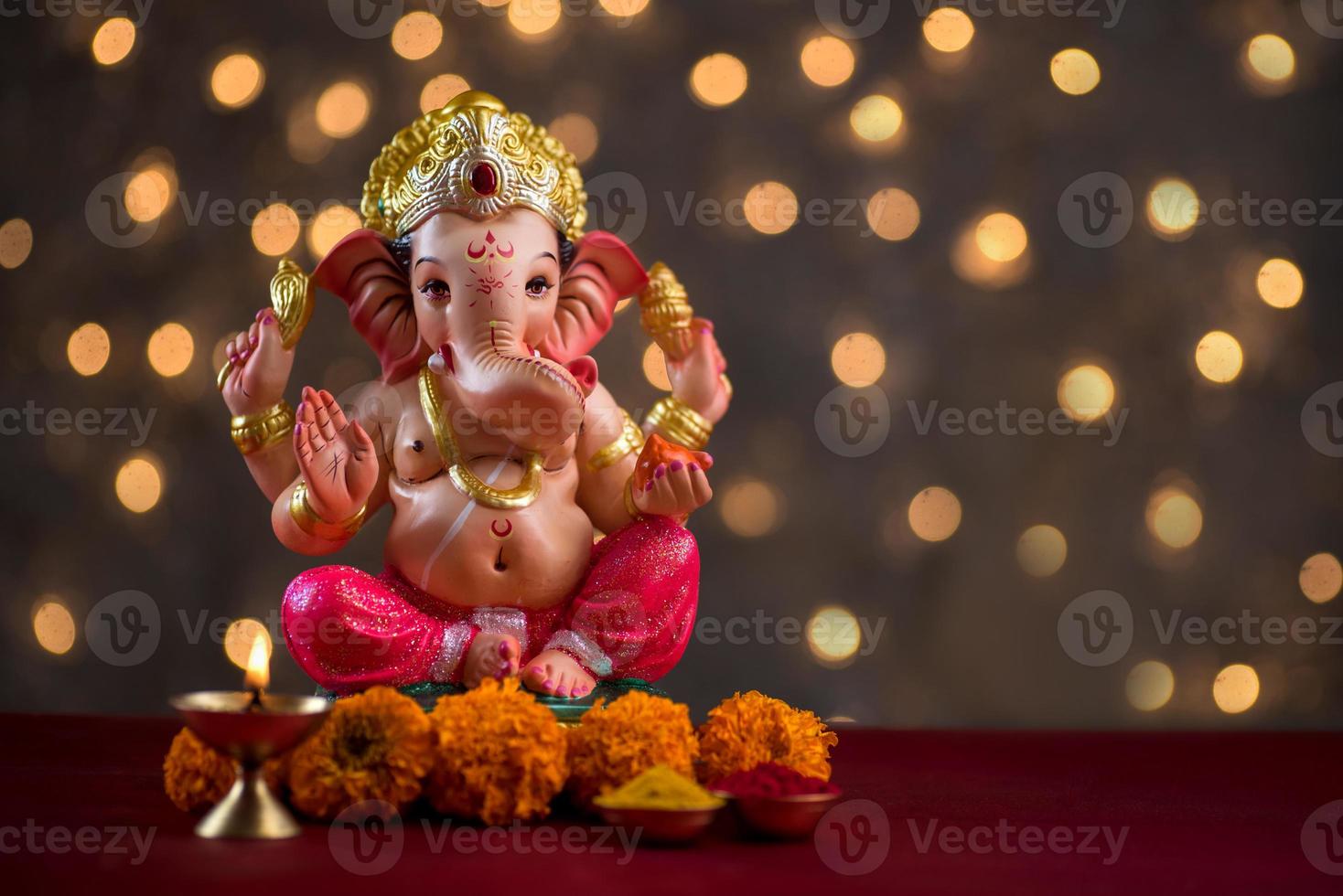 Hindu God Ganesha on Blured bokeh background, Ganesha Idol. photo