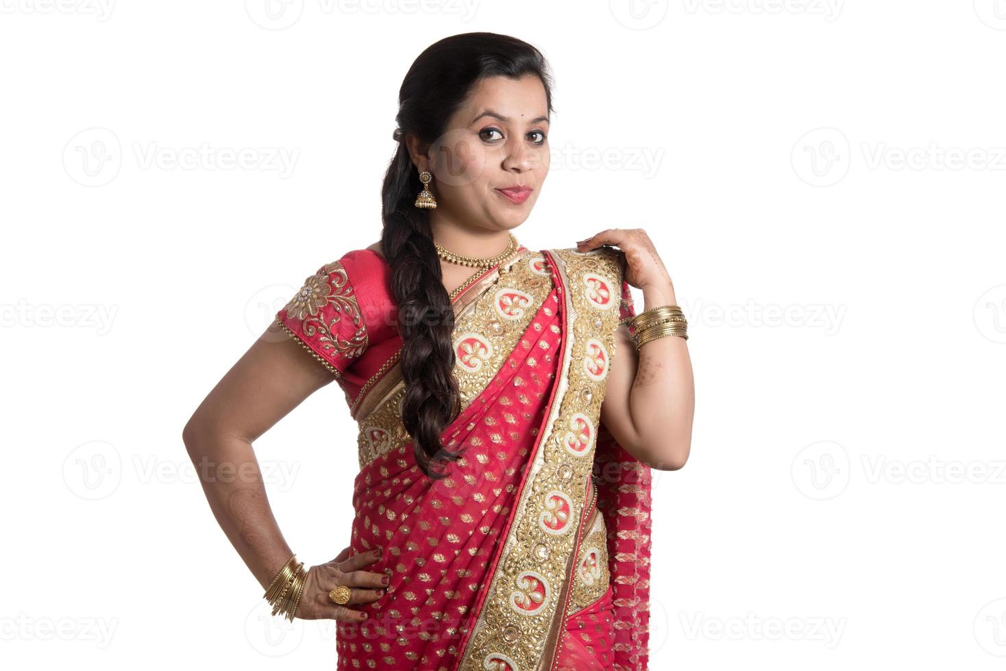 Beautiful young girl posing in Indian traditional saree on white background. photo