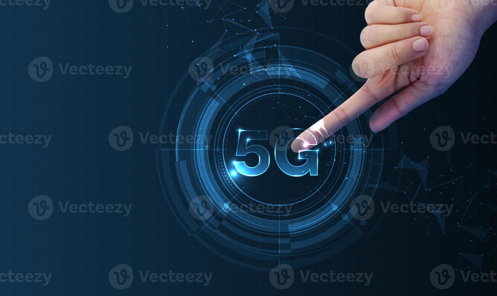 Hand pointing 5G network wireless systems and internet of things with man touching with wireless high-speed Internet communication network background photo