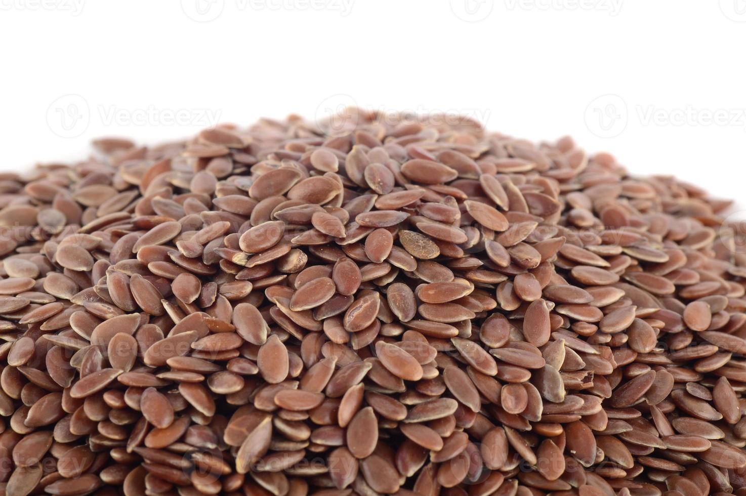 close up of flax seeds isolated on white background photo