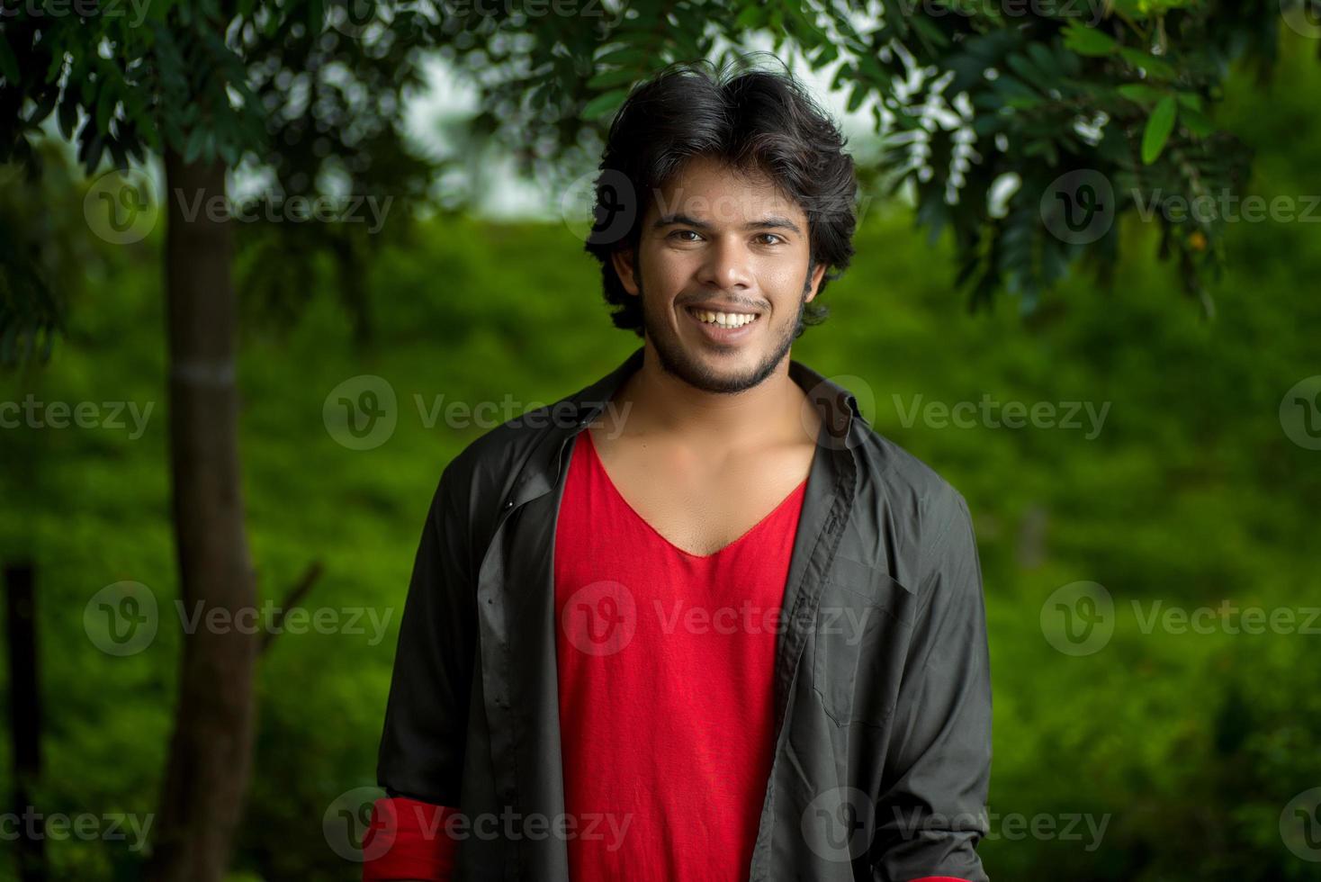 Handsome fashion young man posing outdoors photo