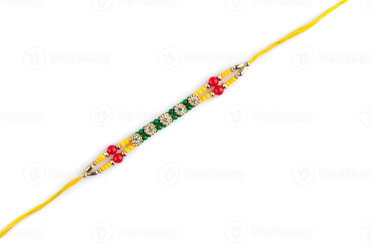 Indian festival Raksha Bandhan background with an elegant Rakhi on a white background photo