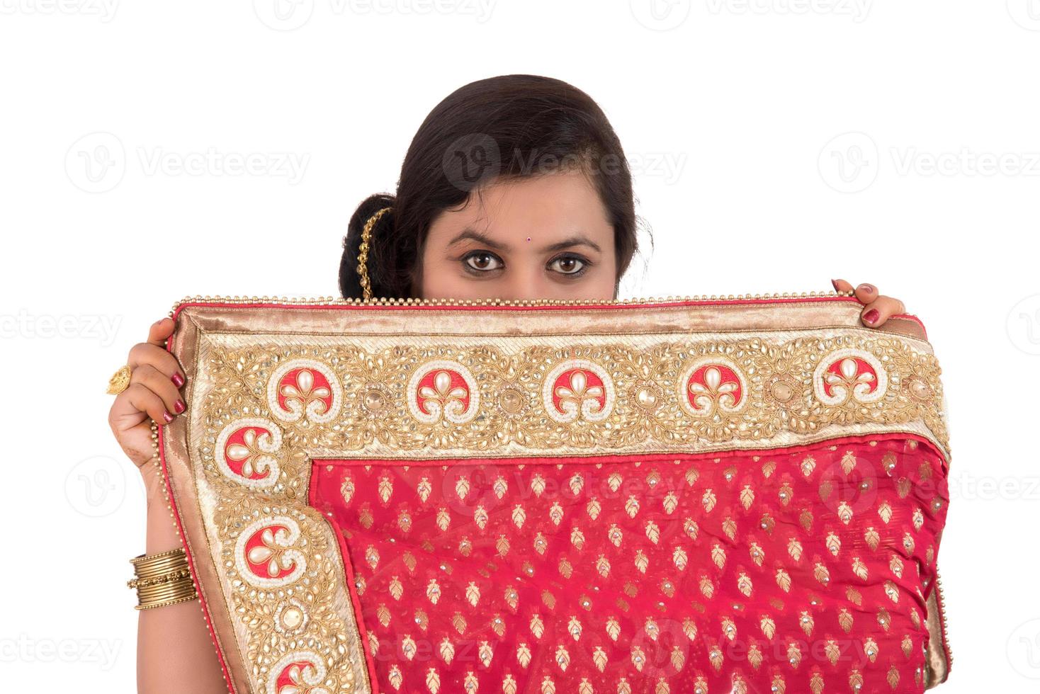 Beautiful young girl posing in Indian traditional saree on white background. photo