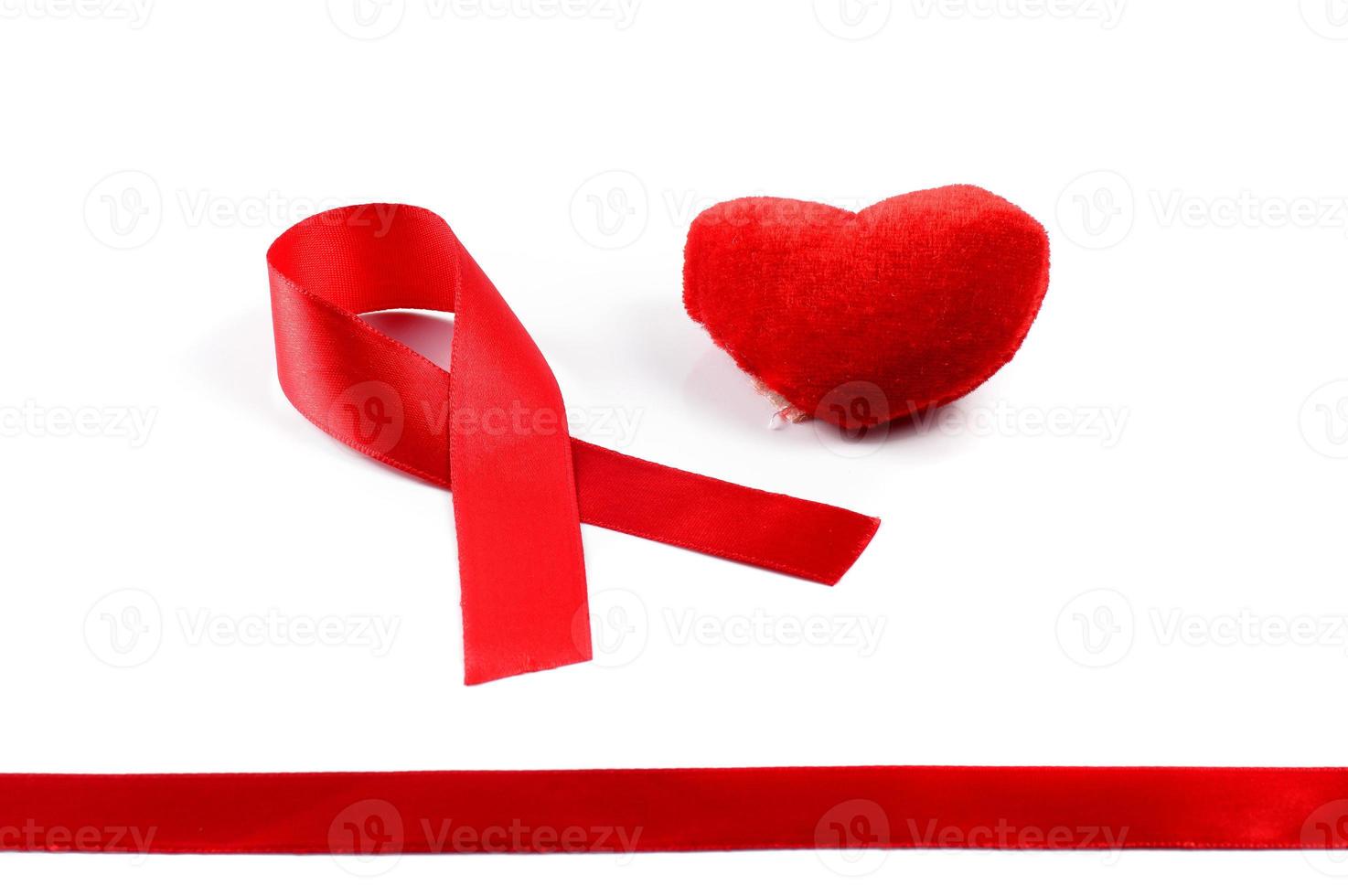 Aids ribbon and heart on white background. photo