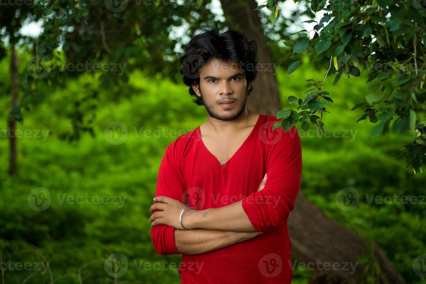 Handsome fashion young man posing outdoors photo