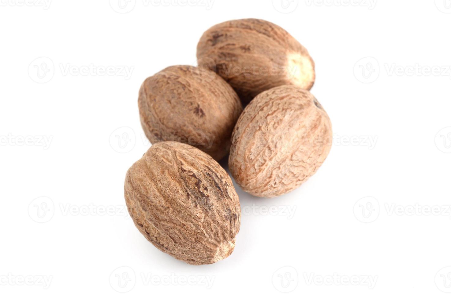 Nutmeg isolated on white background. Close up. photo