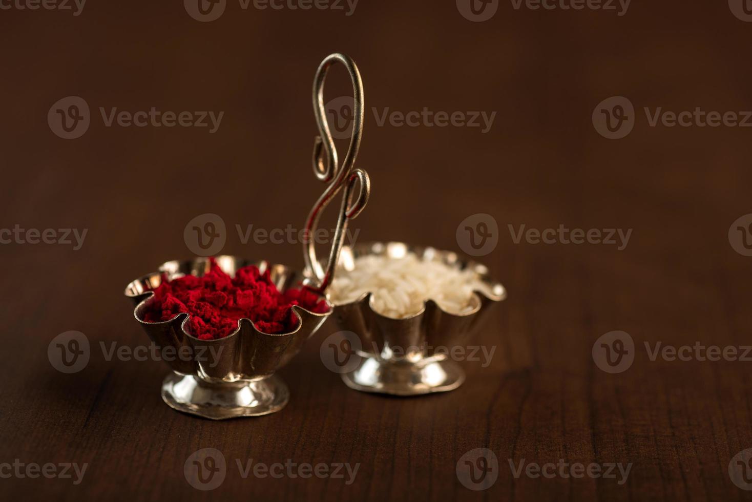 Kumkum and rice grain container. Natural color powders are used while worshipping God and an at auspicious occasions. photo