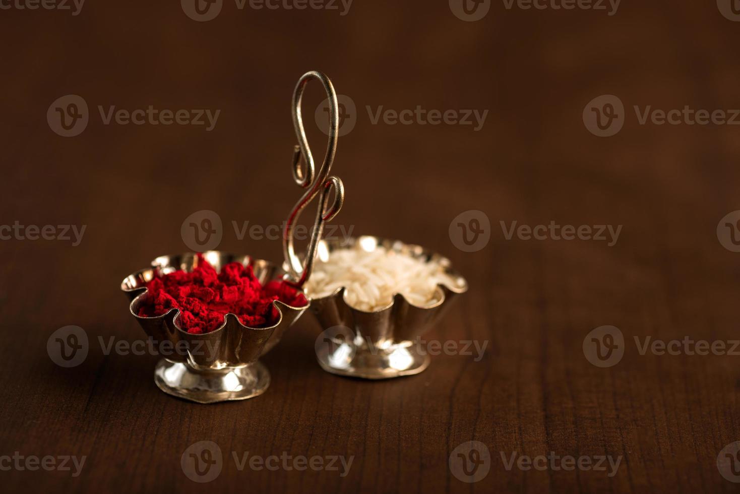 Kumkum and rice grain container. Natural color powders are used while worshipping God and an at auspicious occasions. photo