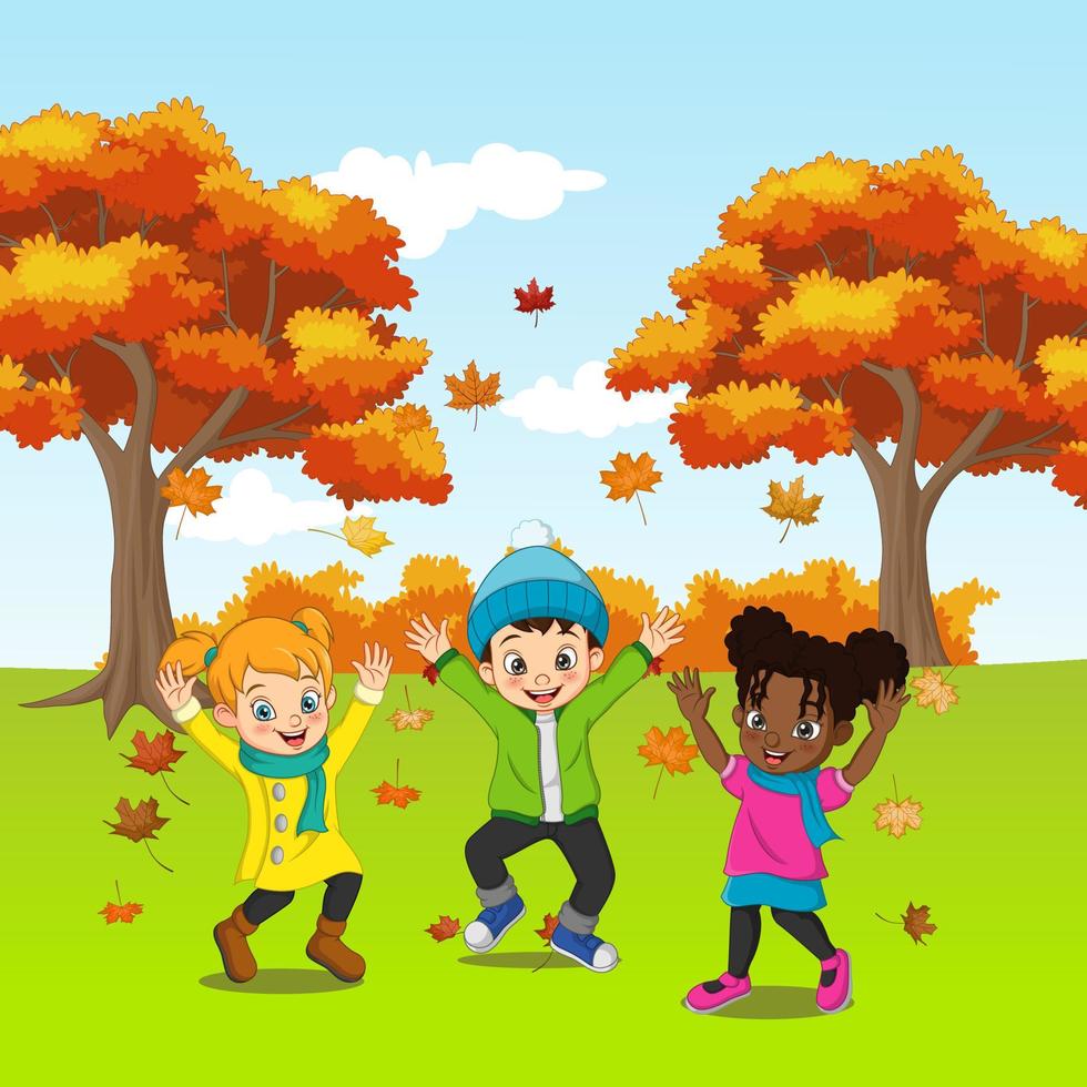 Cartoon Happy kids playing in autumn background vector