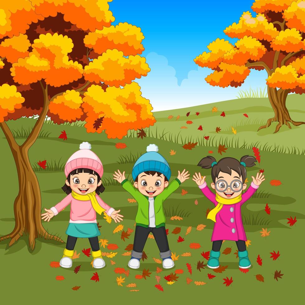 niños felices de dibujos animados jugando en el fondo de otoño 4993850  Vector en Vecteezy
