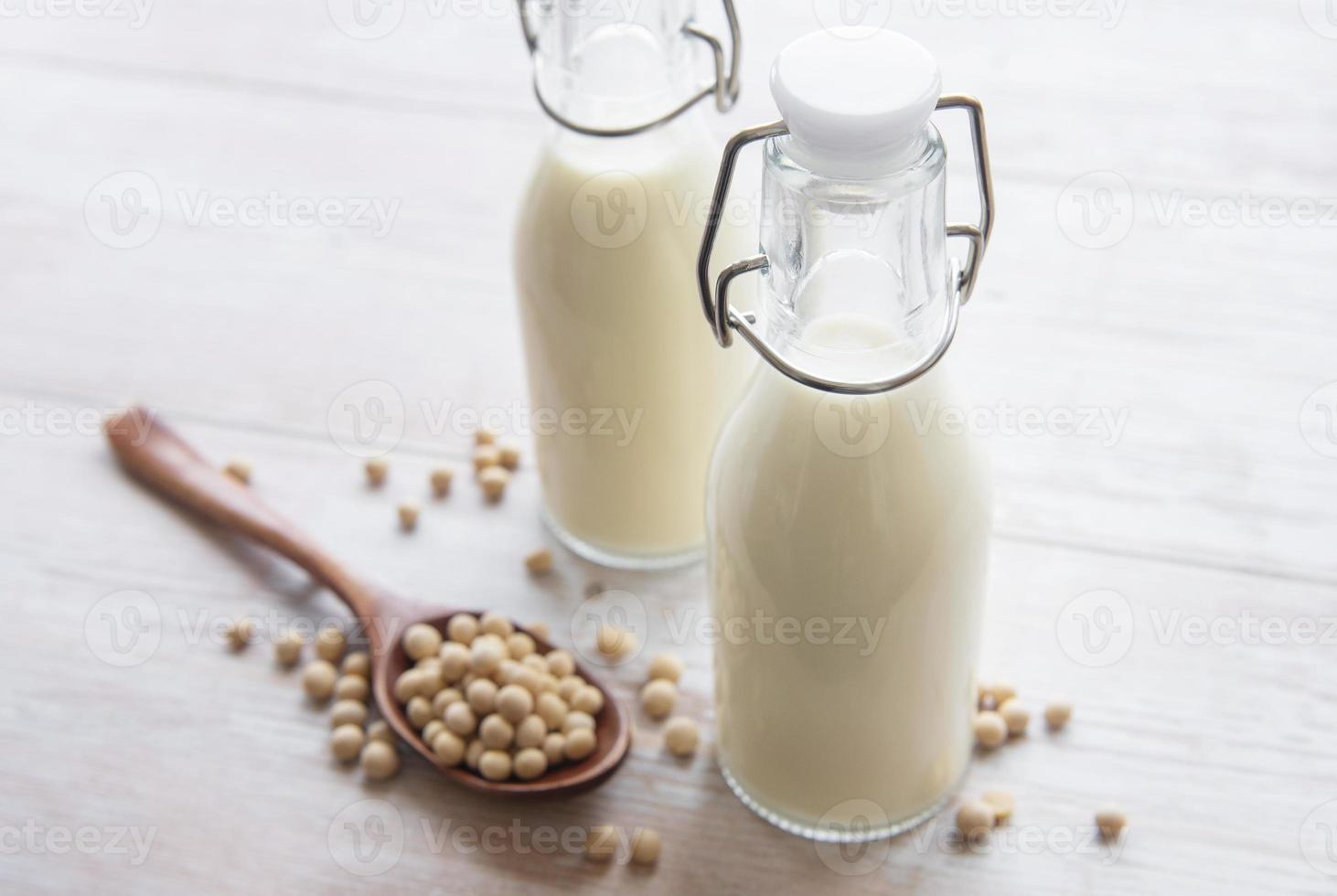 Soy milk and soy on the table photo