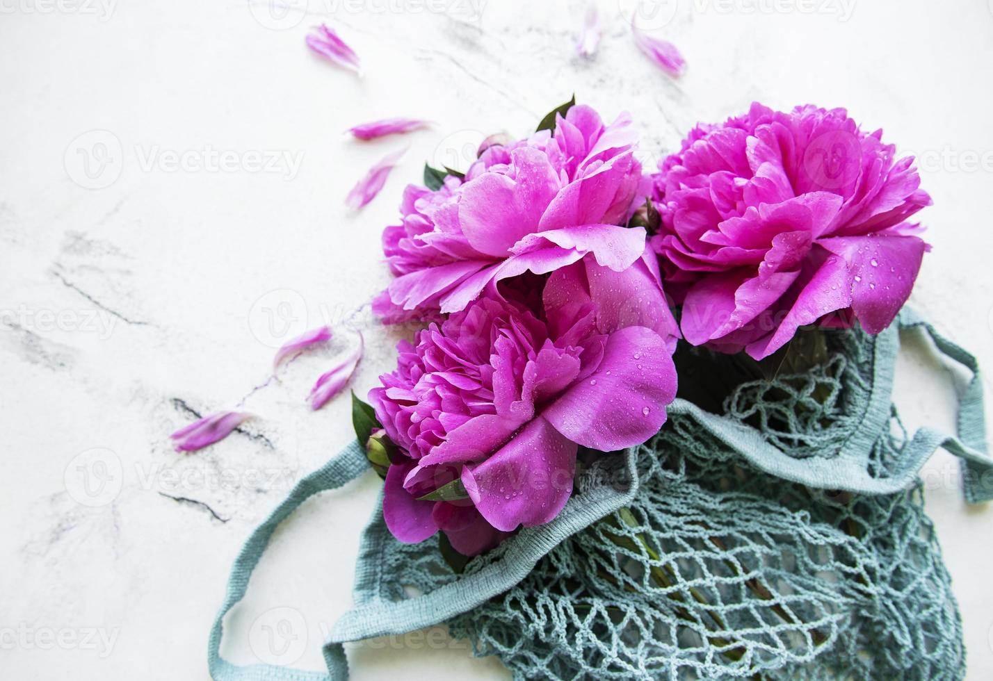 Mesh bag with peony flowers photo