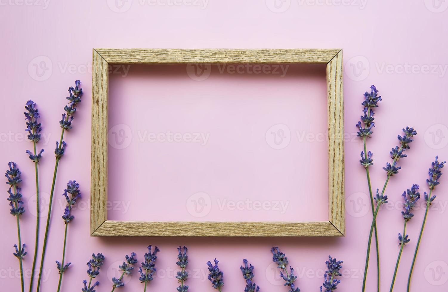 Wooden frame with beautiful flowers of fragrant lavender photo